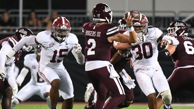 Alabama Crimson Tide linebacker Dallas Turner (15) and Alabama Crimson Tide linebacker Jihaad Campbell (30) put pressure on Mississippi State Bulldogs quarterback Will Rogers (2) in Davis Wade Stadium.